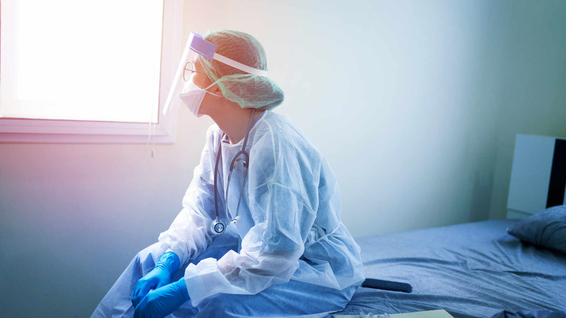 Clinician in full personal protective equipment